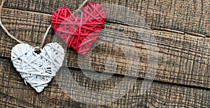White and red heart on a wooden background