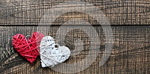 White and red heart on a wooden background