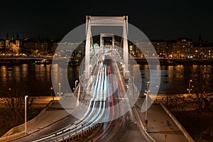 White and red light trails of cars on Elisabeth bridge over Danube at night Budapest Hungary Europe