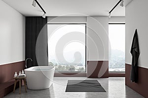 White and red loft bathroom with tub, side view