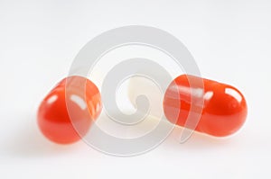 White and red medicine antibiotic pills