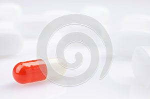 White and red medicine antibiotic pills