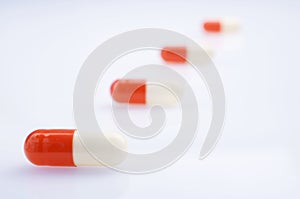 White and red medicine antibiotic pills