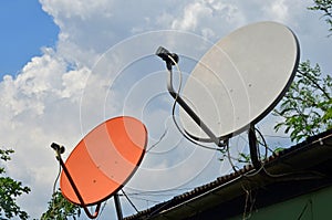 White and red satellite dishes