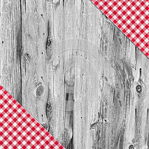 White and red tablecloth textile on wooden table