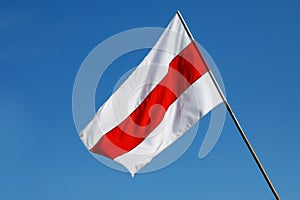White-red-white flag on blue sky background. Historical Belarus authentic flag