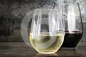 White and Red Wine in Stemless Glasses with Slate Background