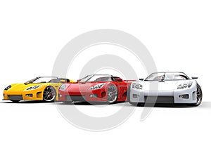 White, red and yellow sportscars photo