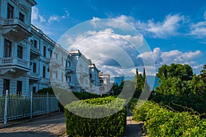 White renascence style building in green garden.