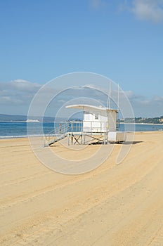 White rescue hut on a sandy beach, safe relax by the ocean, a be