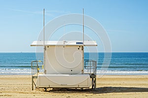 White rescue hut on a sandy beach, safe relax by the ocean, a be