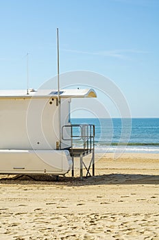 White rescue hut on a sandy beach, safe relax by the ocean, a be