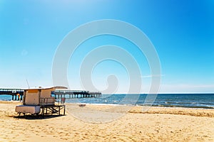 White rescue hut on a sandy beach, safe relax by the ocean, a be