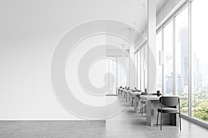 White restaurant interior with seats and tables in row near window. Mockup wall