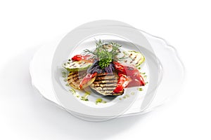 White Restaurant Plate of Grilled Vegetables and Fresh Greens Isolated