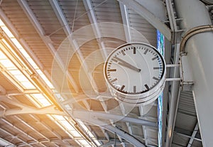 White retro big clock show time an instrument to measure for traveler and people at BTS skytrain station bangkok Thailand with photo