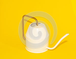 White retro-style watering can on a yellow background