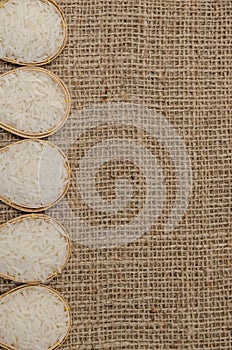 The white rice in the bamboo bowl on the sack bag for background text