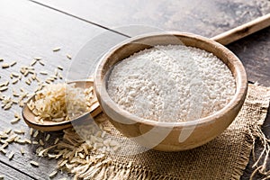 White rice flour in a bowl on wood