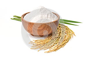 White rice flour in wooden bowl with rice ears