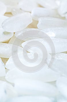 White rice grains closeup, background and texture