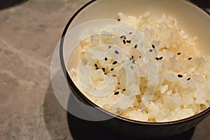 White rice with sesame seeds on the table
