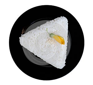 White rice triangle shape in black ceremic dish isolated on whit photo