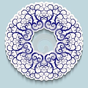 White ring frame with blue openwork pattern on light background with shadow. Paper cut 3d ornamental border. Invitation or