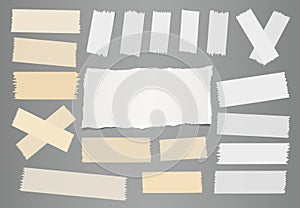 White ripped notebook, note paper sheet, sticky adhesive sticky tape for text or message on gray background.