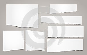 White ripped notebook paper, torn note paper strips for text or message are on brown background. Vector illustration