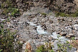 White river or Rio Blanco Valley with fast running water between the stones, Peru