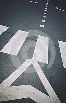 White road markings on gray asphalt close up