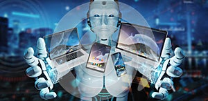 White robot connecting modern smartphone tablet laptop and computer 3D rendering