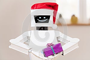 White robot with gift in his hands