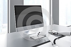 Robot hands typing in office