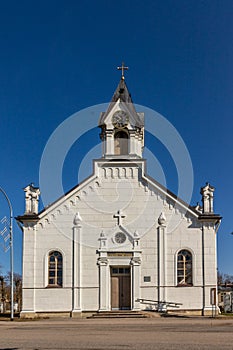 White rock chapel at blue sky background.