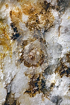 White rock with yellow discoloration