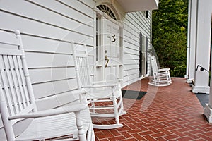 White Rockers on Red Tile Porch