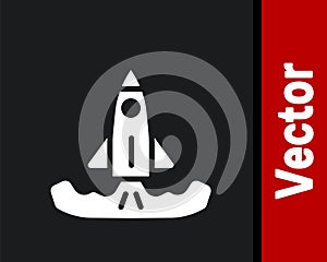 White Rocket icon isolated on black background. Vector