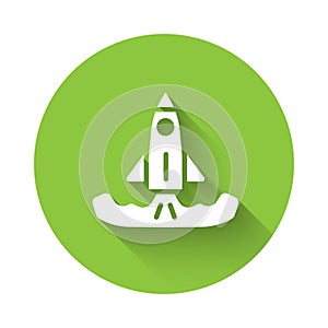 White Rocket icon isolated with long shadow. Green circle button. Vector