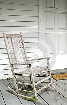 Antique White Rocking Chair on Porch