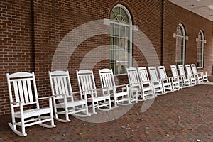 White rocking chairs in a row in downtown Staunton, Virginia, USA