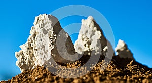 White rocks on a background of blue sky.