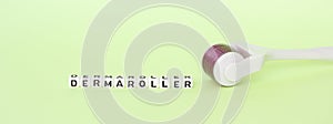 White roller with mesotherapy handle and the inscription `dermaroller`.