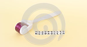 White roller with mesotherapy handle and the inscription `mezoroller`