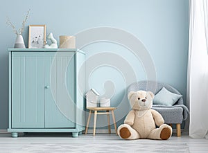 In a white room adorned with star patterns on the walls, there stands a petite light blue armchair designed for children