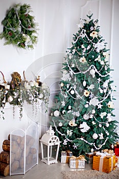 White room with christmas-tree and colorful gift