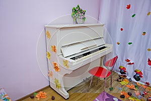 White grand piano on a white background. play music . White room with columns and the piano about a wall . White piano in the dark