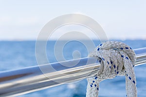 White rope on railing of yacht boat