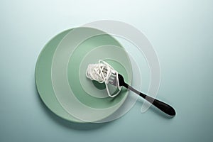 White rope on a round plate. Spaghetti concept